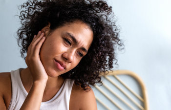 woman with jaw or tooth pain, Lawrenceville, GA